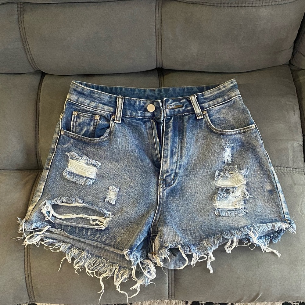 Mid-high waisted jeans shorts. Very cute just a little small for me. Size Medium